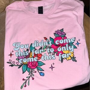 Pink Graphic T-Shirt with Floral Design. Never Worn